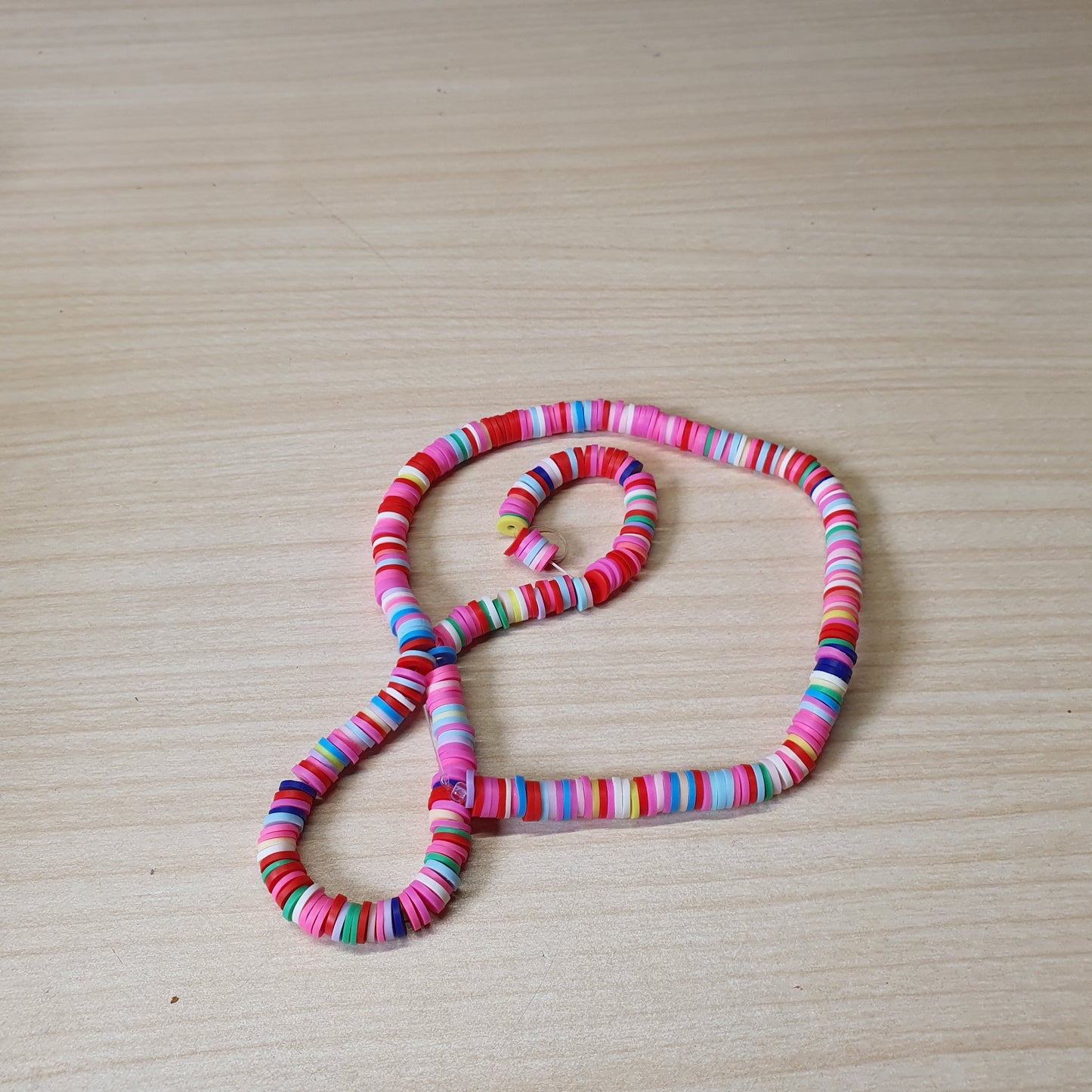 Pink polymer clay Heishi disc beads commonly used for jewelry making.#6951