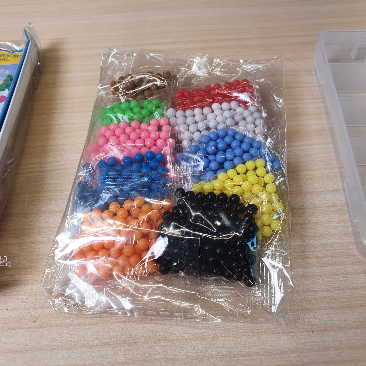 DIY set features small, colorful plastic beads that stick together when sprayed with water.#9057