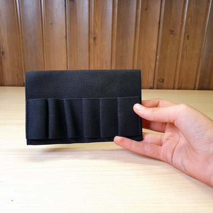 Black elastic tactical ammunition carrier is designed to hold shotgun shells or rifle cartridges for quick reloading #3264