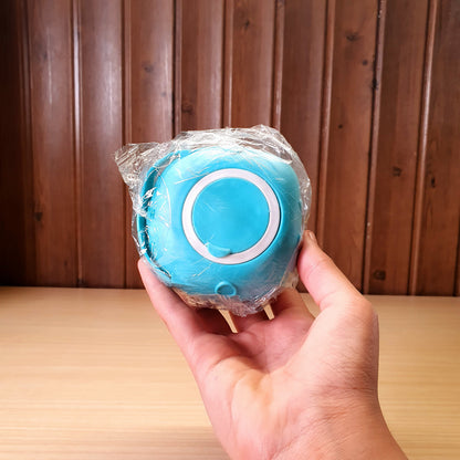 Blue silicone bath body brush featuring a built-in soap dispenser for convenient showering. #3353