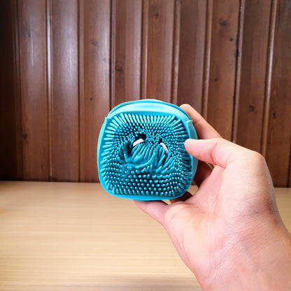 Blue silicone bath body brush featuring a built-in soap dispenser for convenient showering. #3353