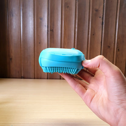 Blue silicone bath body brush featuring a built-in soap dispenser for convenient showering. #3353