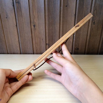 Magnetic wooden print hangers utilize hidden magnets to clamp onto artwork.#4145