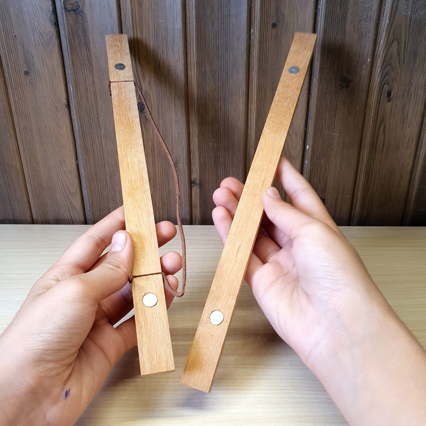 Magnetic wooden print hangers utilize hidden magnets to clamp onto artwork.#4145
