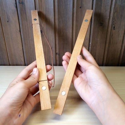 Magnetic wooden print hangers utilize hidden magnets to clamp onto artwork.#4145