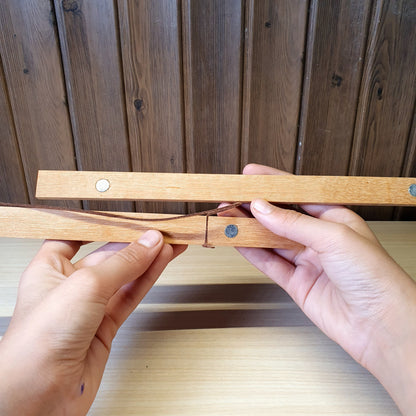 Magnetic wooden print hangers utilize hidden magnets to clamp onto artwork.#4145