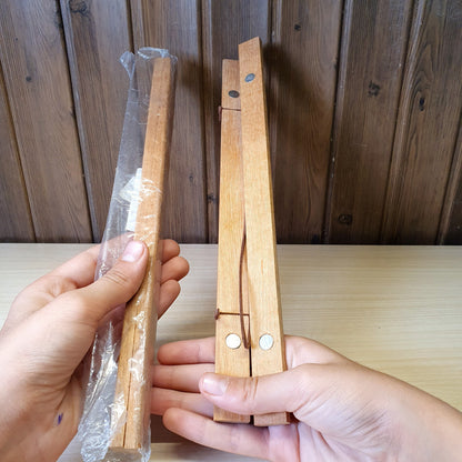 Magnetic wooden print hangers utilize hidden magnets to clamp onto artwork.#4145