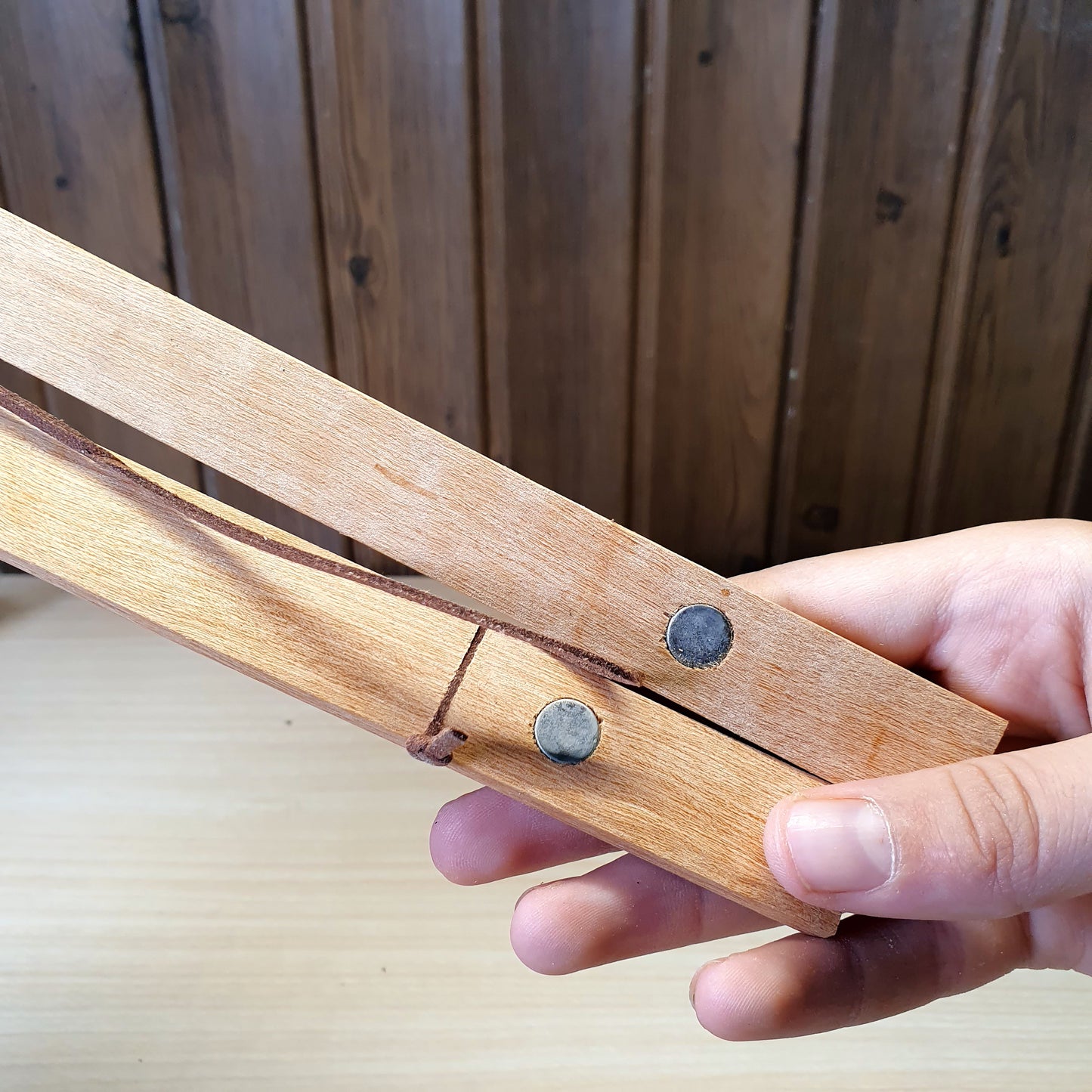 Magnetic wooden print hangers utilize hidden magnets to clamp onto artwork.#4145