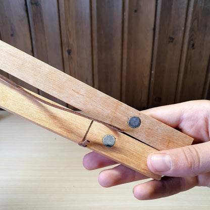 Magnetic wooden print hangers utilize hidden magnets to clamp onto artwork.#4145