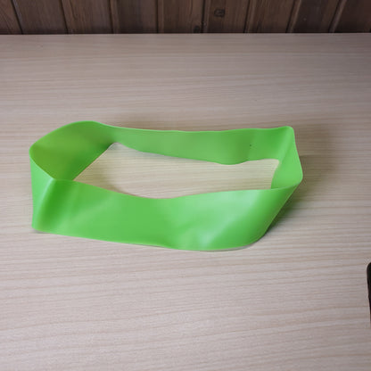 Green resistance band is a versatile tool for workouts, strength training, and stretching.#6219