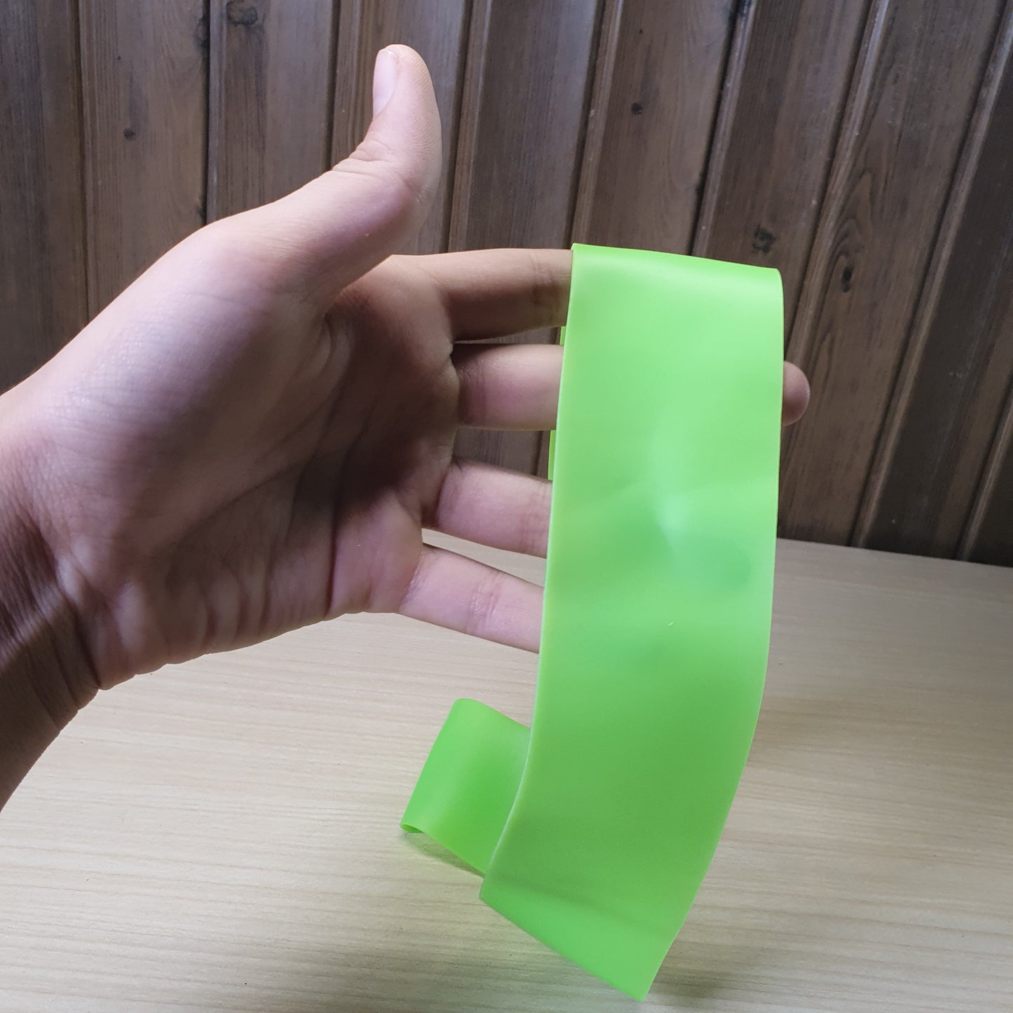 Green resistance band is a versatile tool for workouts, strength training, and stretching.#6219