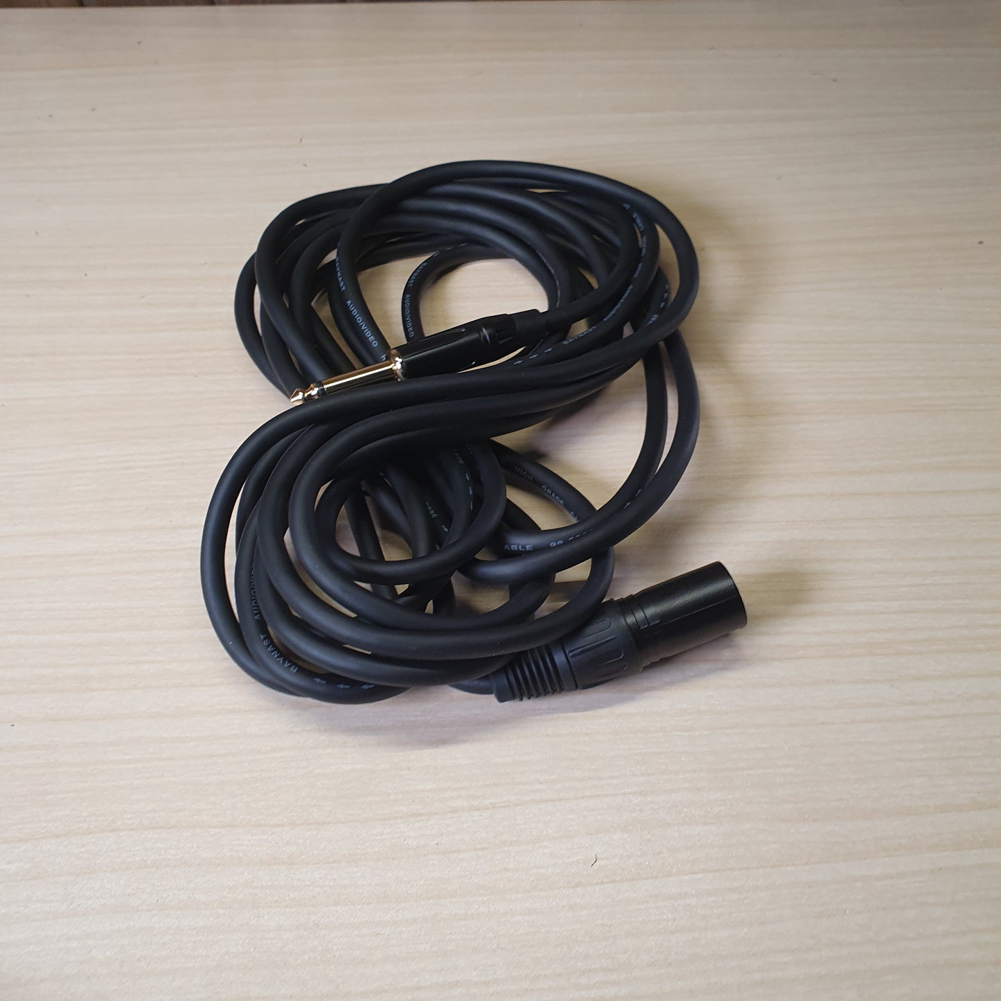professional audio cable featuring a female XLR connector on one end and a 1/4" (6.35mm) mono jack plug on the other.#6167