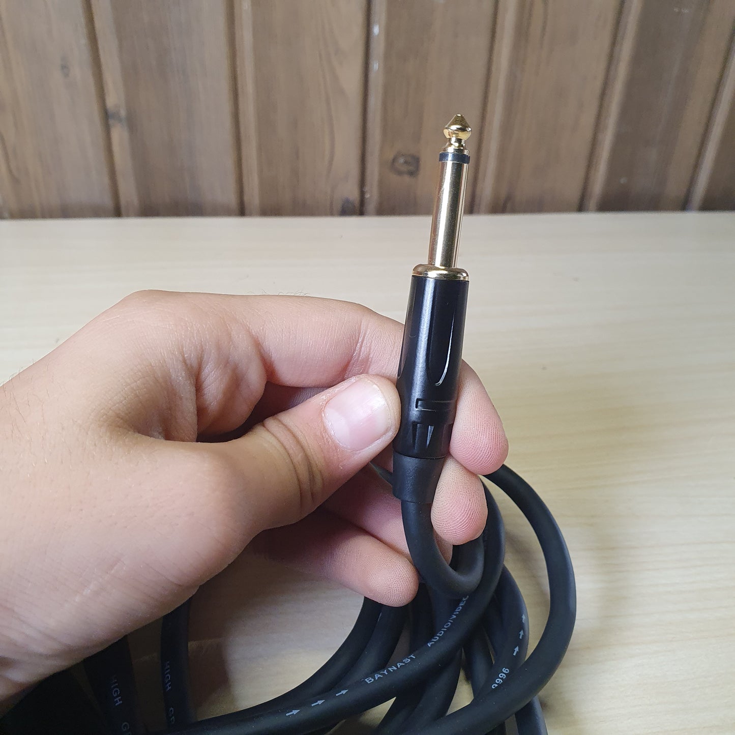 professional audio cable featuring a female XLR connector on one end and a 1/4" (6.35mm) mono jack plug on the other.#6167