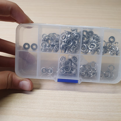 Metal snaps and fastener components, often used for sewing clothing or crafting.#6182