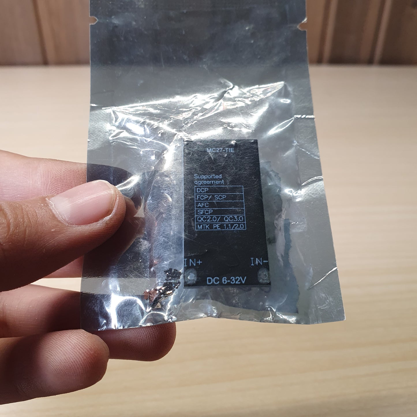 DC buck converter charging module, likely the MH-KC24 model, designed to step down higher input voltages (6V-32V) to a standard 5V USB output. #6380
