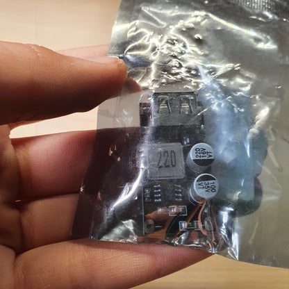 DC buck converter charging module, likely the MH-KC24 model, designed to step down higher input voltages (6V-32V) to a standard 5V USB output. #6380