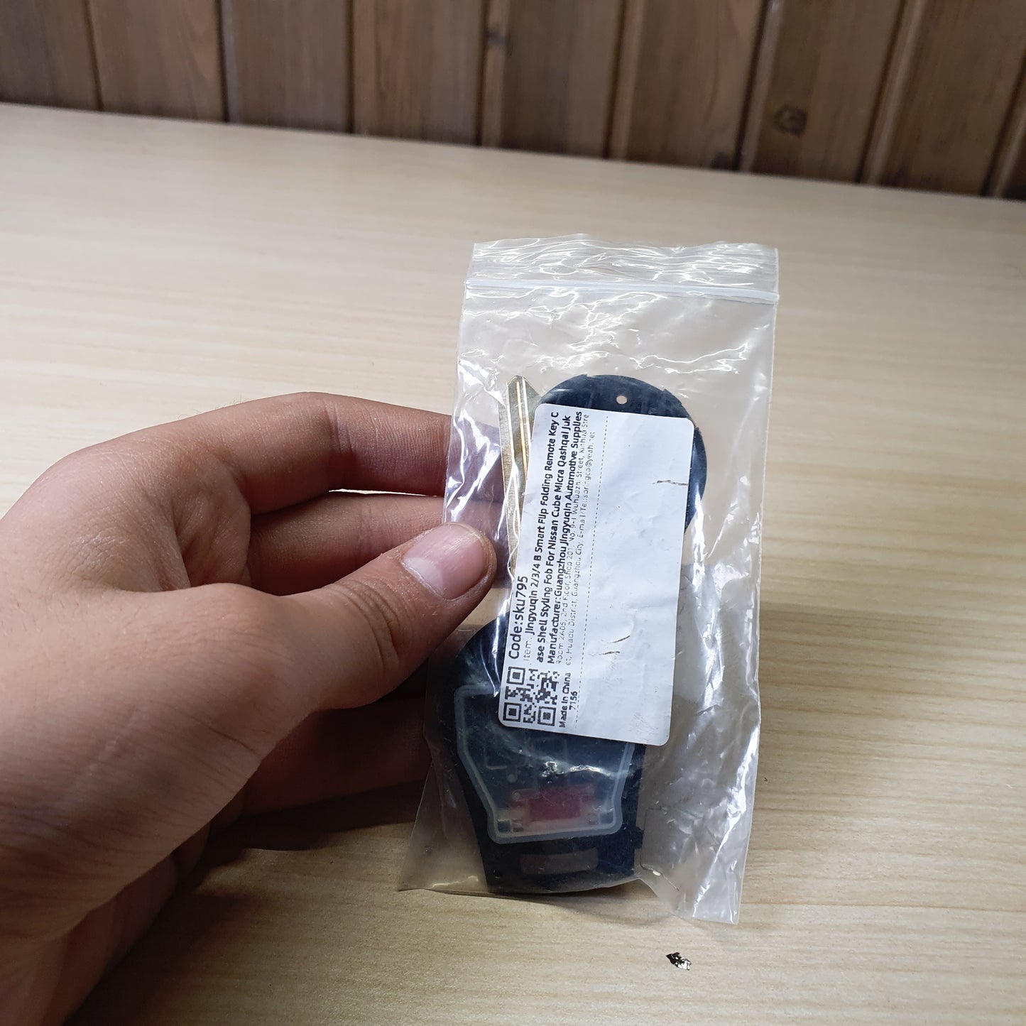Nissan remote head key featuring a 3-button configuration (Lock, Unlock, Trunk) and an uncut brass blade # 6360