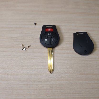 Nissan remote head key featuring a 3-button configuration (Lock, Unlock, Trunk) and an uncut brass blade # 6360