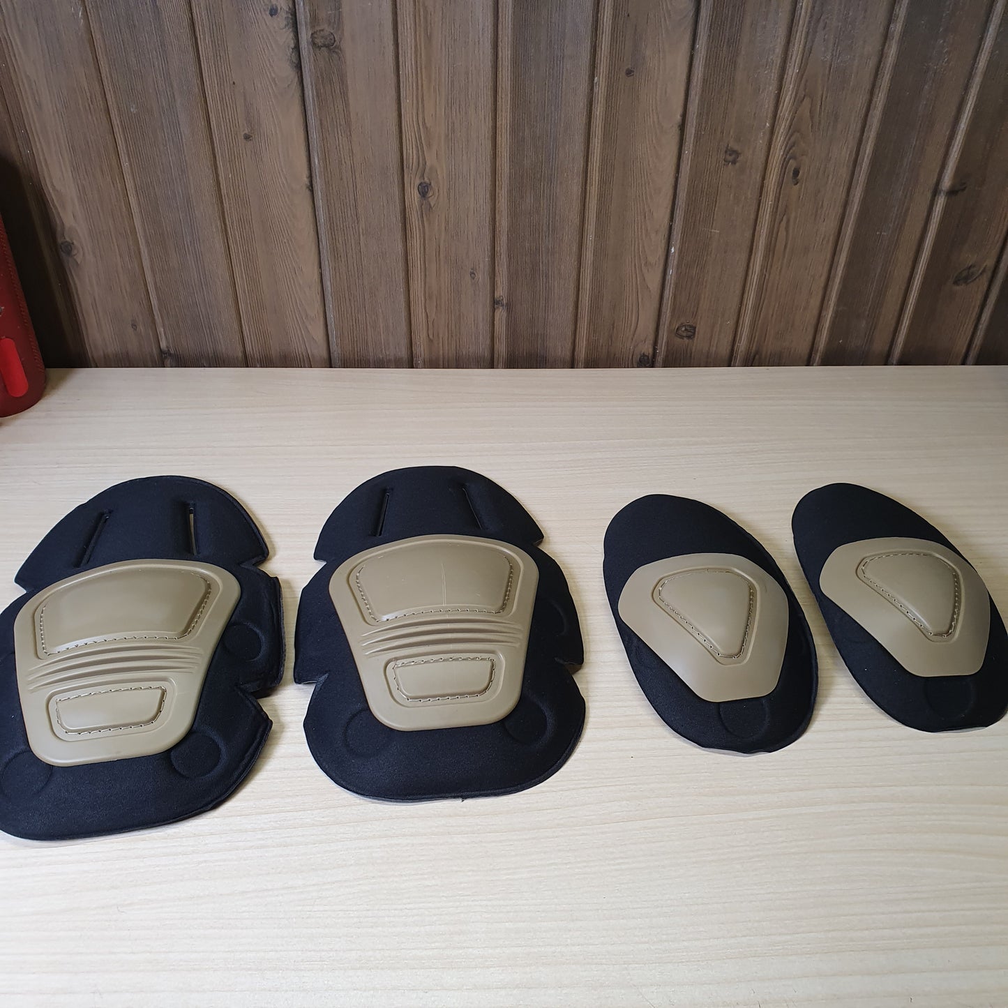 Crye Precision AirFlex Combat Knee Pads feature a flexible khaki cap and a black foam backing. #6705
