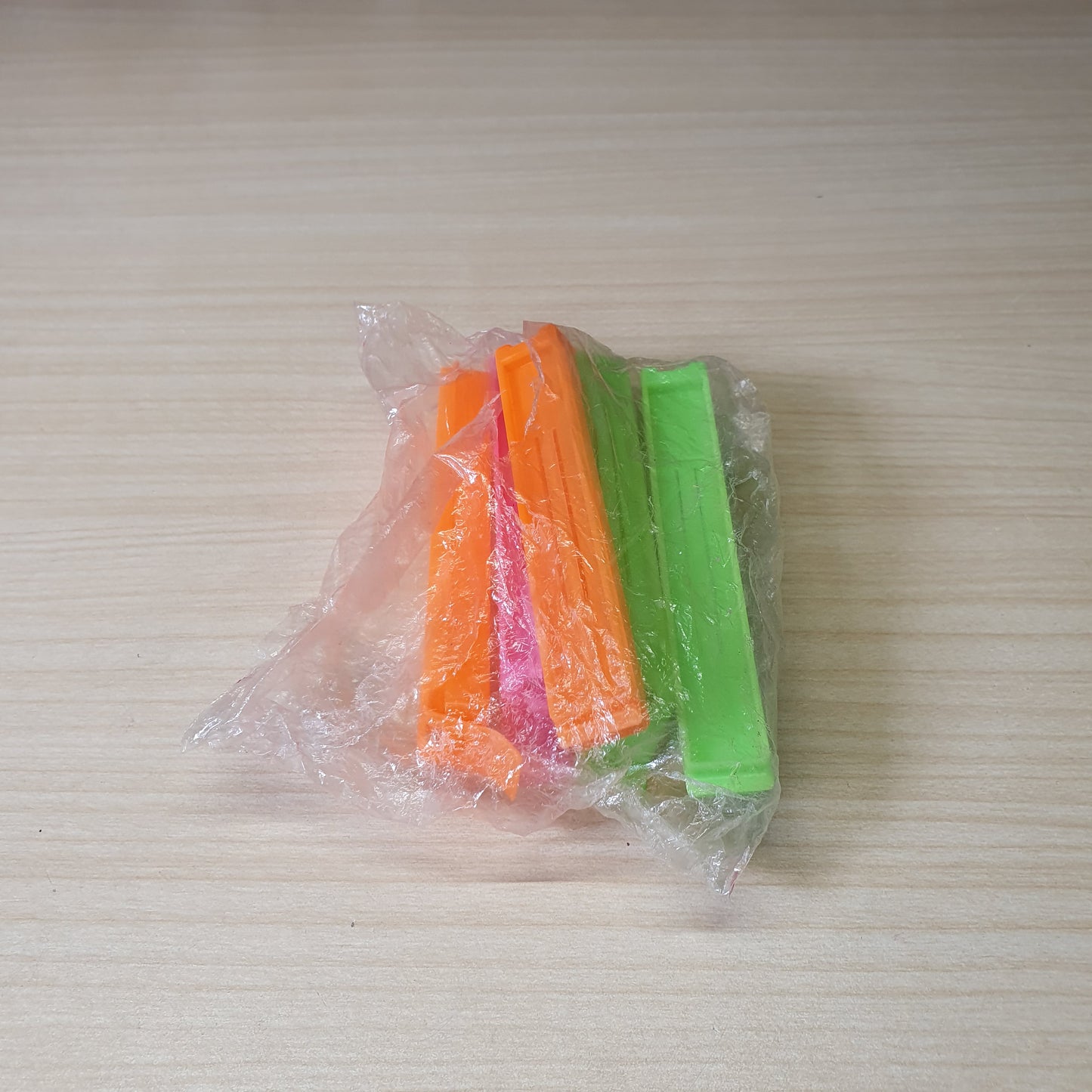 Plastic snack bag clips designed to create an airtight seal for food freshness. #6819