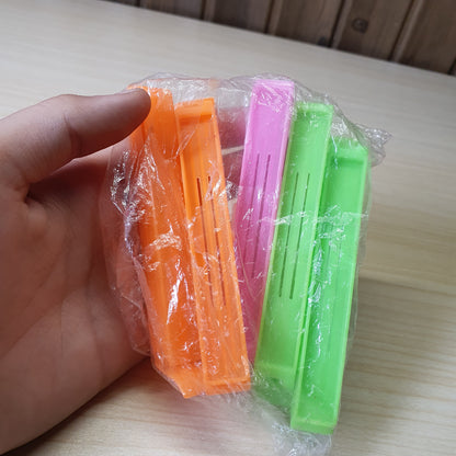 Plastic snack bag clips designed to create an airtight seal for food freshness. #6819