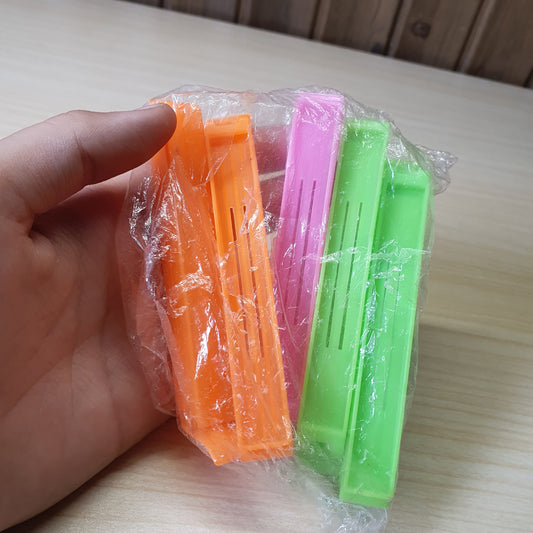 Plastic snack bag clips designed to create an airtight seal for food freshness. #6819