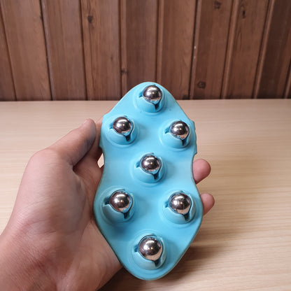 Handheld massage tool features seven 360-degree rotating metal balls designed for deep tissue relief #6516