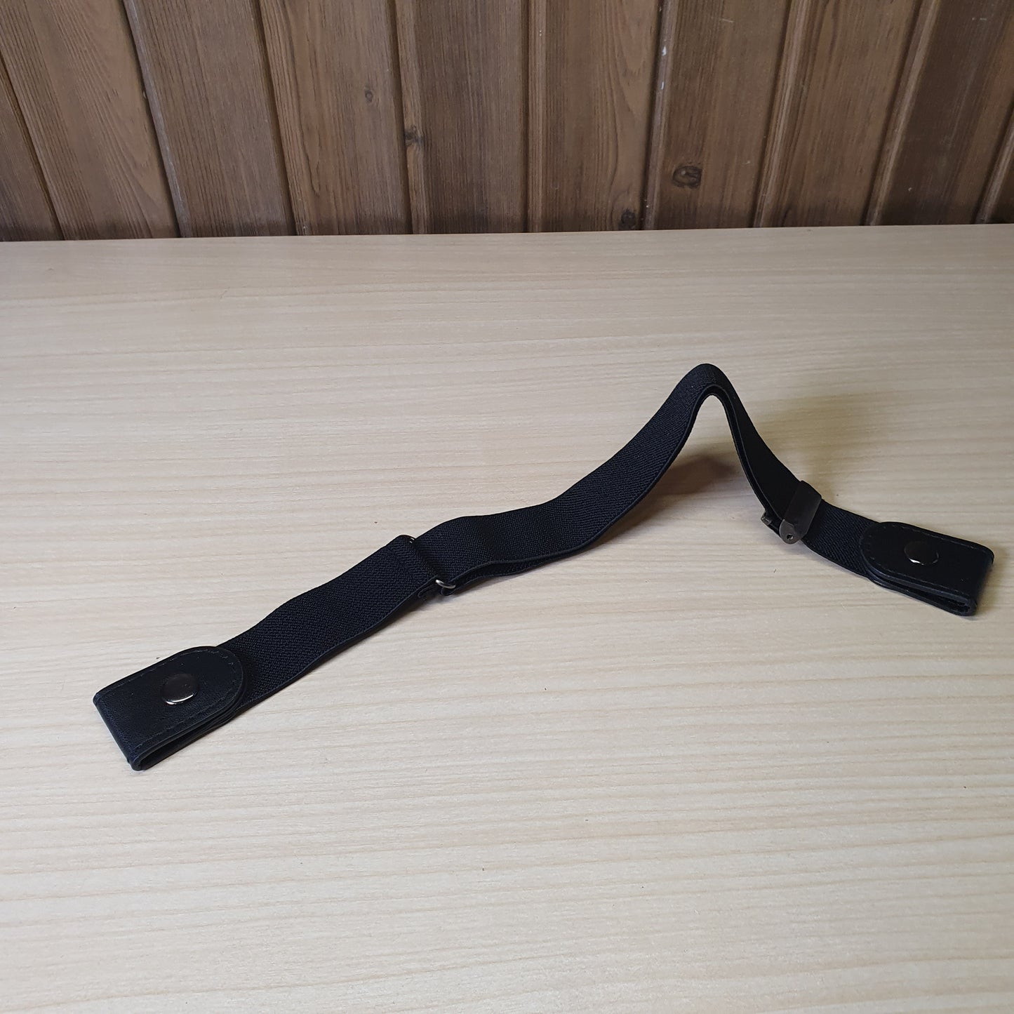 Black buckle-free elastic belt features a sleek, invisible design meant to lay flat under clothing.#6627