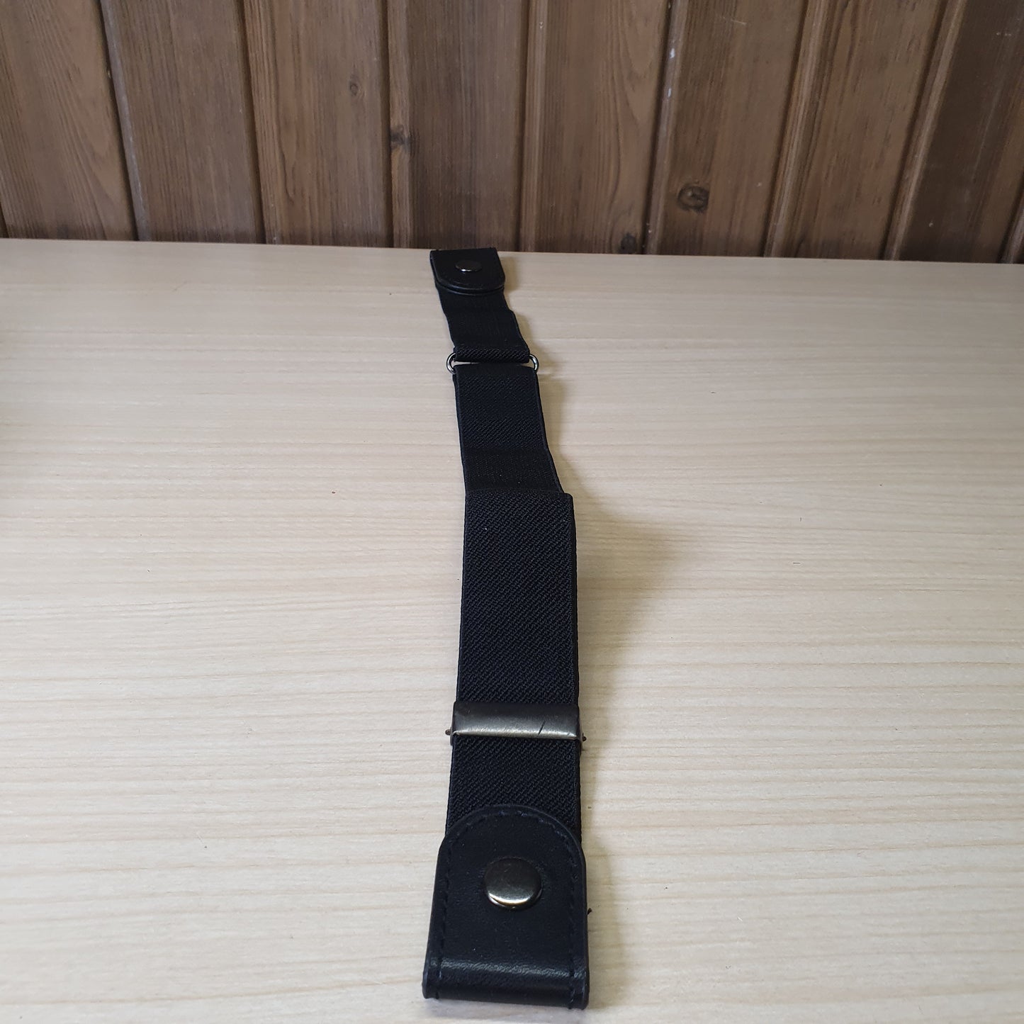 Black buckle-free elastic belt features a sleek, invisible design meant to lay flat under clothing.#6627
