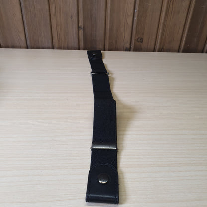 Black buckle-free elastic belt features a sleek, invisible design meant to lay flat under clothing.#6627