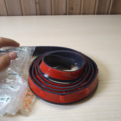 Flexible rubber strip used for various vehicle protection or sealing applications.  #6725
