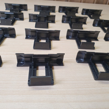 Plastic water drainage clips designed to prevent water accumulation, dirt, and dust buildup on solar panels. #6962