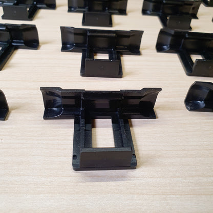 Plastic water drainage clips designed to prevent water accumulation, dirt, and dust buildup on solar panels. #6962