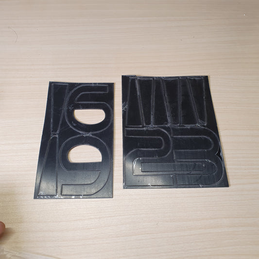 Vinyl adhesive decal sheets featuring numbers for customization. #6981