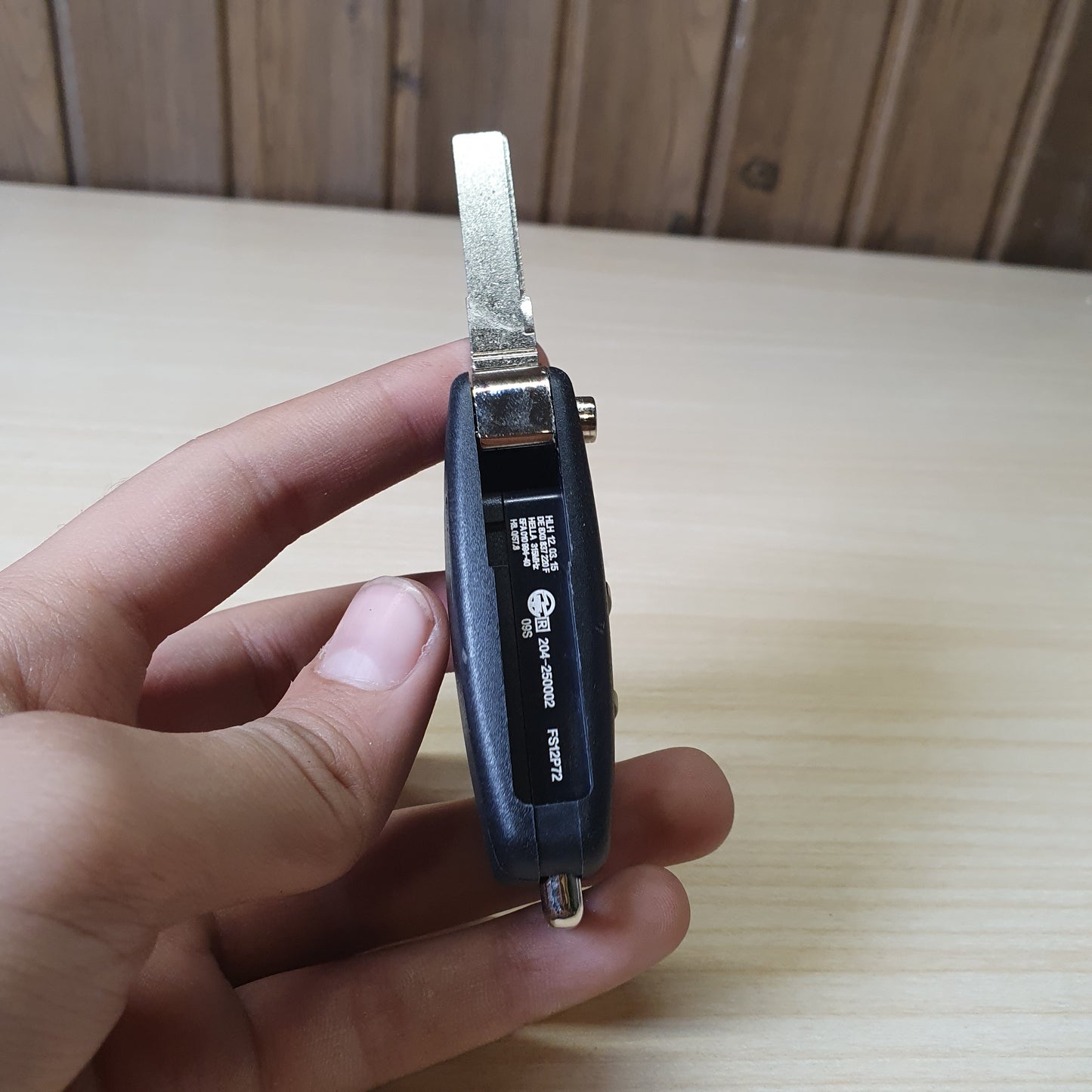 Audi flip key fob featuring a three-button layout for locking, unlocking, and trunk release. #6908