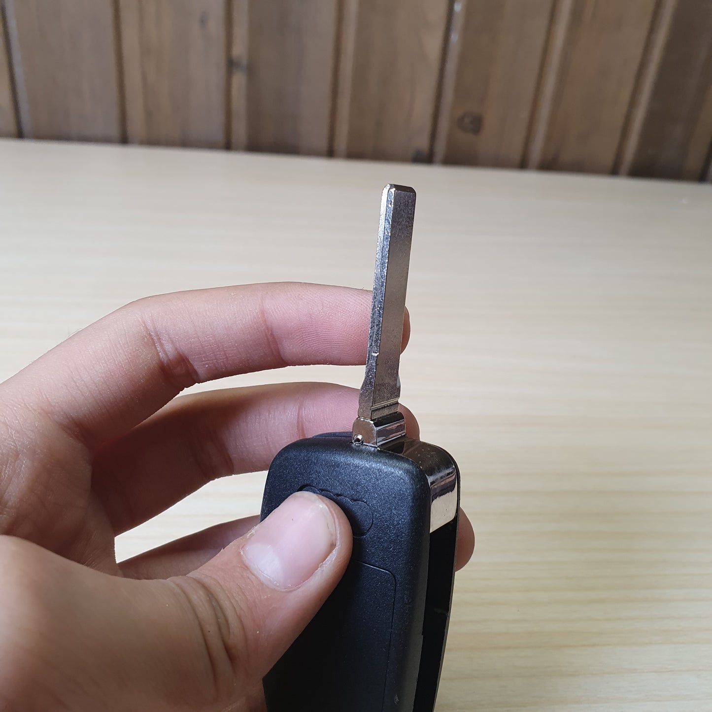 Audi flip key fob featuring a three-button layout for locking, unlocking, and trunk release. #6908