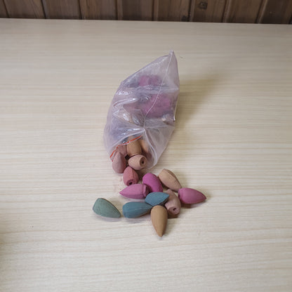 Colorful backflow incense cones designed to create a cascading smoke effect when placed on specialized burners #6732