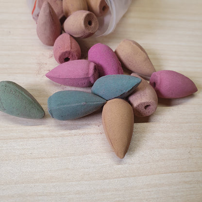 Colorful backflow incense cones designed to create a cascading smoke effect when placed on specialized burners #6732