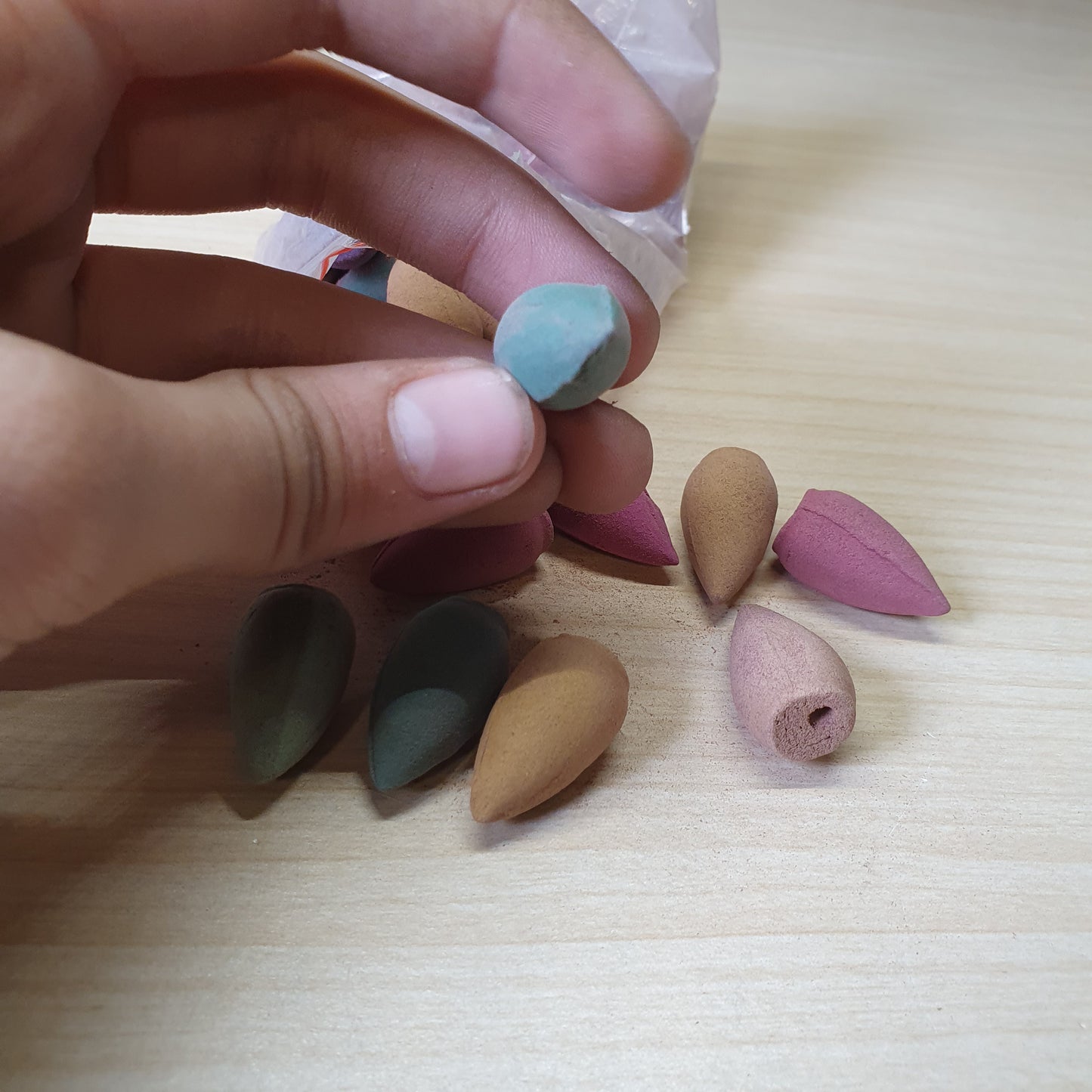 Colorful backflow incense cones designed to create a cascading smoke effect when placed on specialized burners #6732