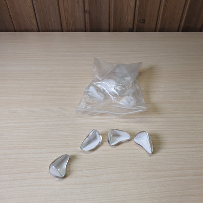 Adhesive-backed corner guards are designed to baby-proof furniture by cushioning sharp edges.#6896