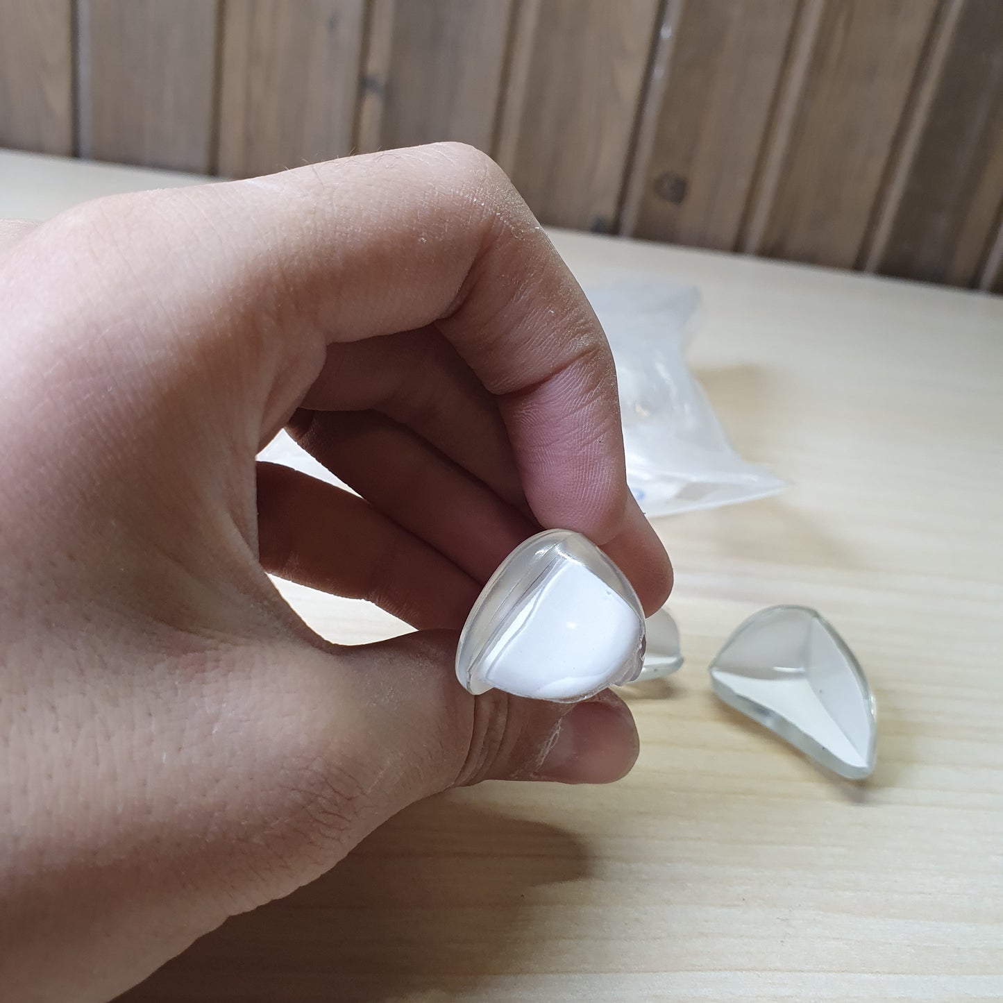 Adhesive-backed corner guards are designed to baby-proof furniture by cushioning sharp edges.#6896