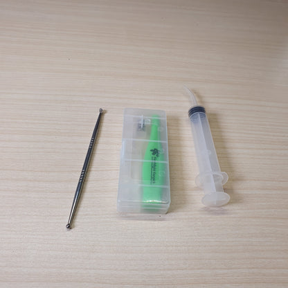Green Flashlight Earpick, a tool used for ear cleaning that features a built-in LED light to help visualize the ear canal. #6561