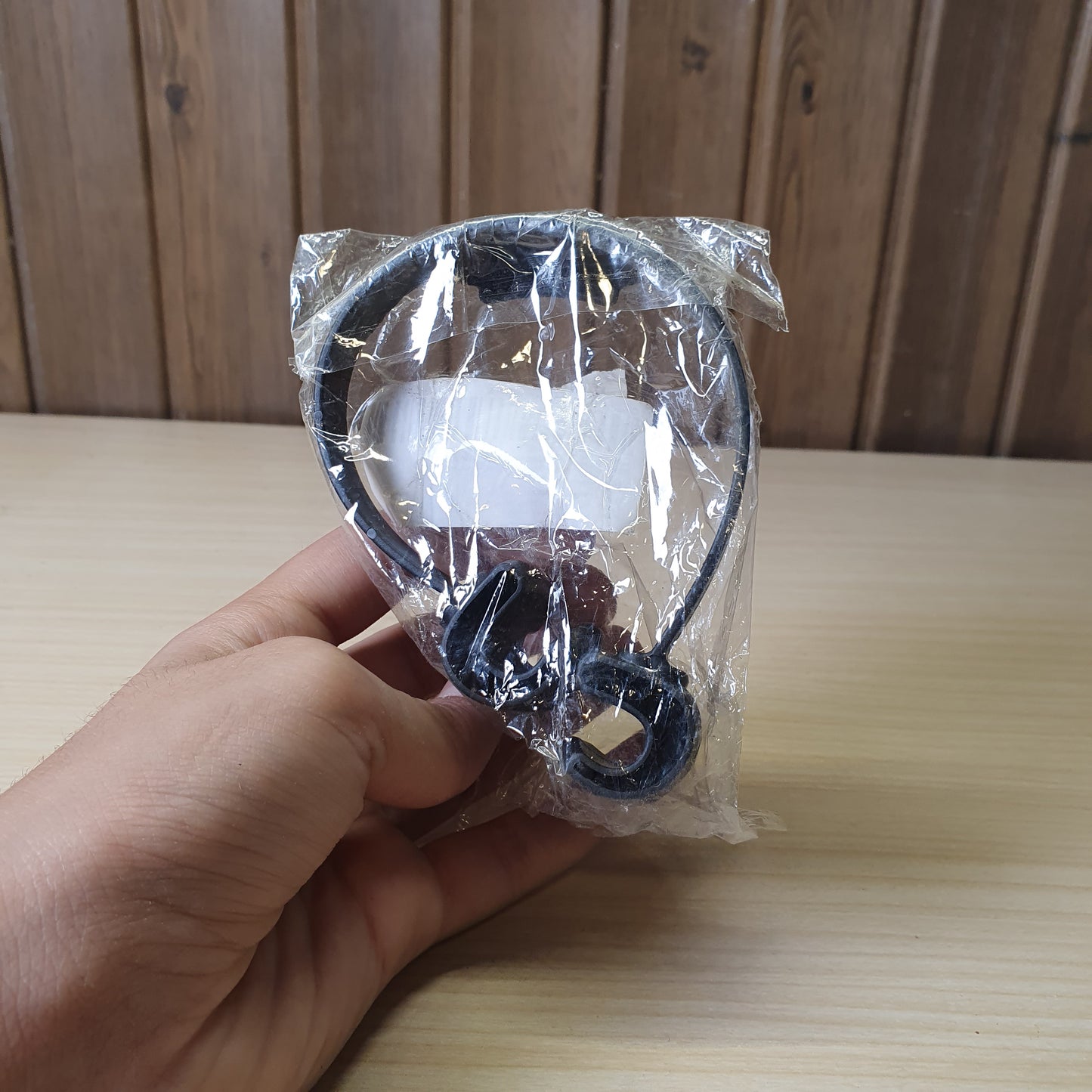 Black "OK Stand" is a flexible, TPU plastic phone holder designed with a thumbs-up shape for hands-free viewing in portrait or landscape modes. #6879