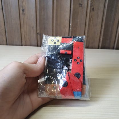 Nintendo Switch-themed card holder and lanyard set featuring the classic neon red and blue joy-con colors. #6852