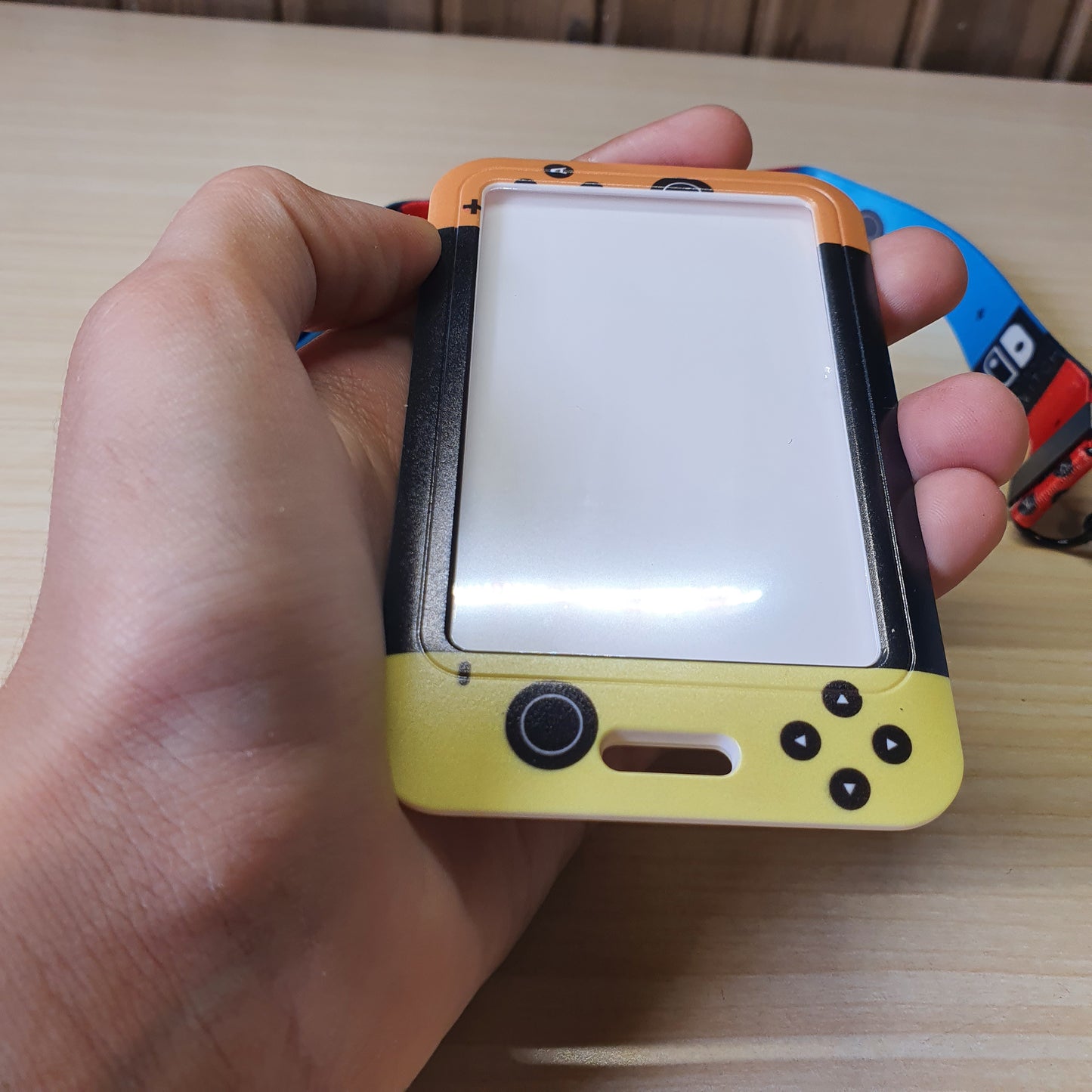 Nintendo Switch-themed card holder and lanyard set featuring the classic neon red and blue joy-con colors. #6852