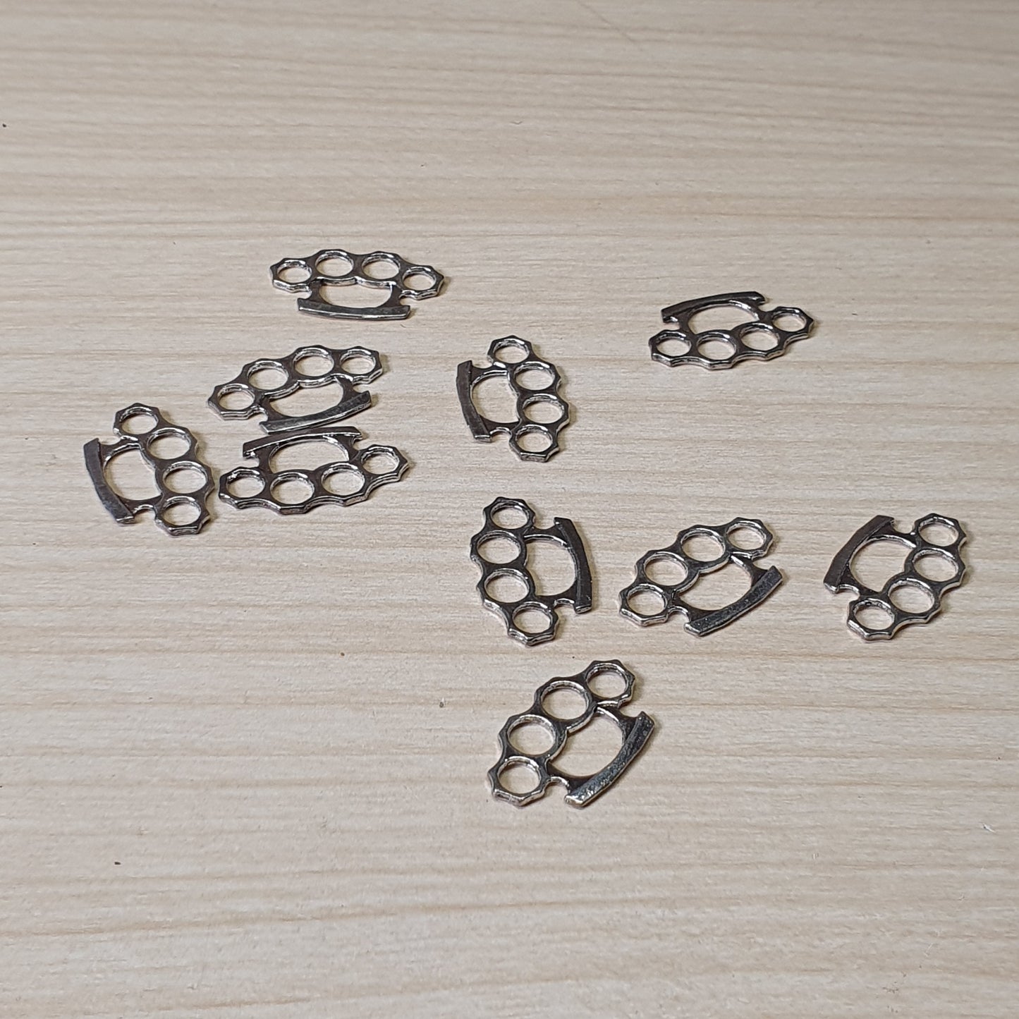 Brass knuckle dusters, often used for jewelry making or crafting #6993