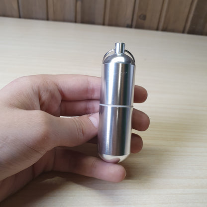 Waterproof aluminum alloy pill container featuring a screw-top lid with a silicone seal and a keyring attachment. #6960