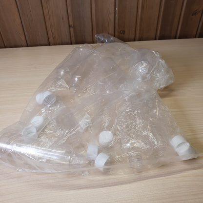 Transparent PET plastic bottles, often used as portable 100ml containers for shampoo or travel kits.#6885
