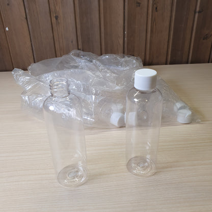 Transparent PET plastic bottles, often used as portable 100ml containers for shampoo or travel kits.#6885