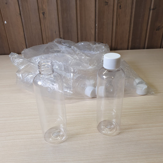 Transparent PET plastic bottles, often used as portable 100ml containers for shampoo or travel kits.#6885
